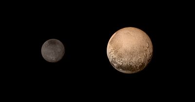 The dwarf planet Pluto with its major moon, Charon
