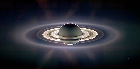A view of Saturn with the Sun behind it showing its ring system